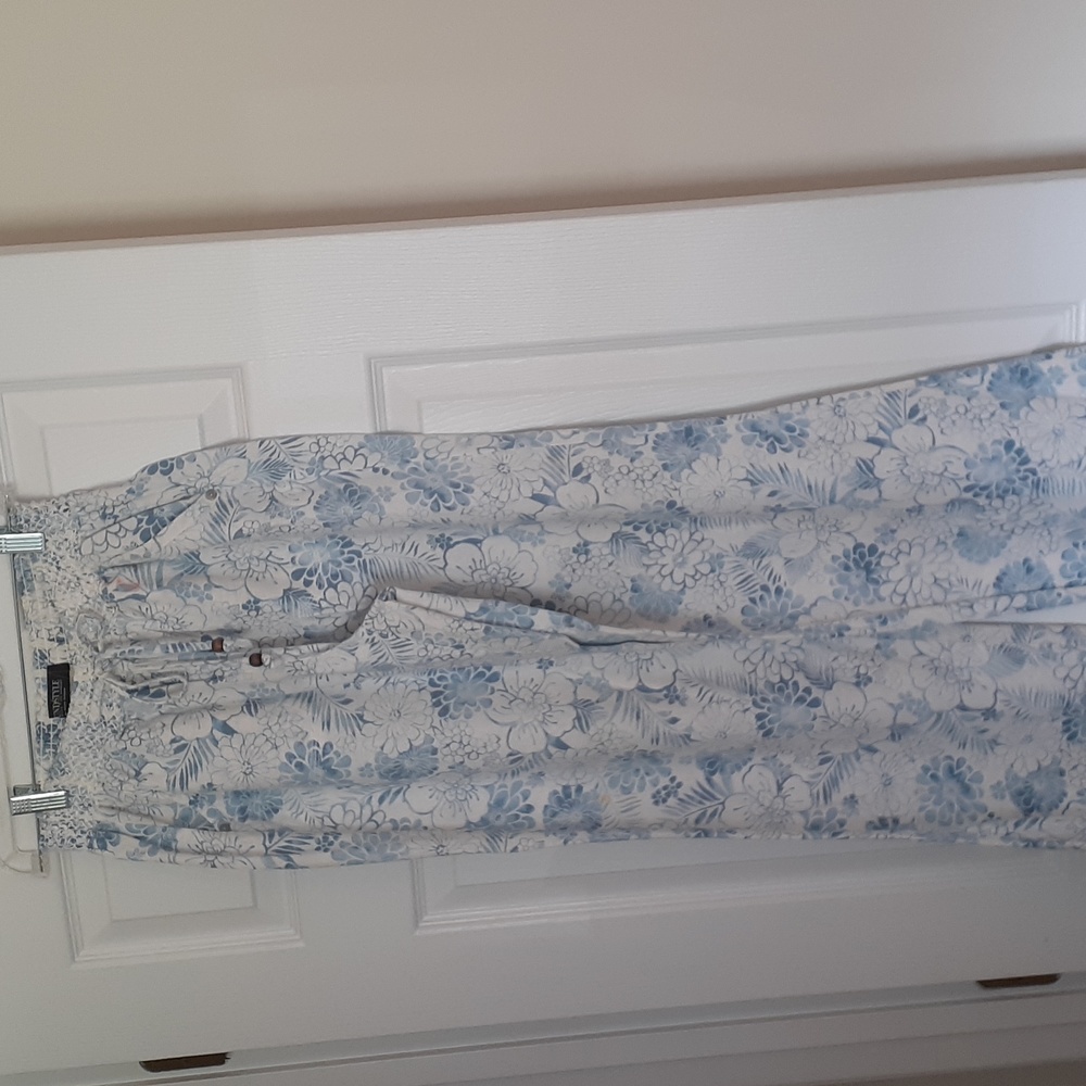 Womans light blue floral drawstring wide leg pants on a white background.